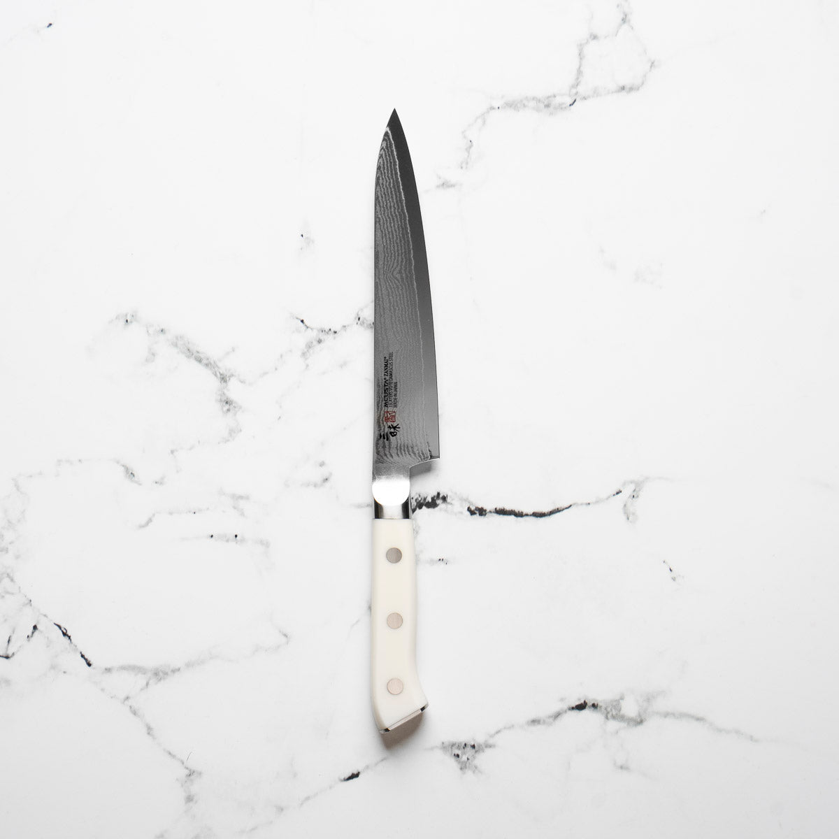 Mcusta Zanmai Corian Classic VG10 Damascus Petty 150mm - blade detail