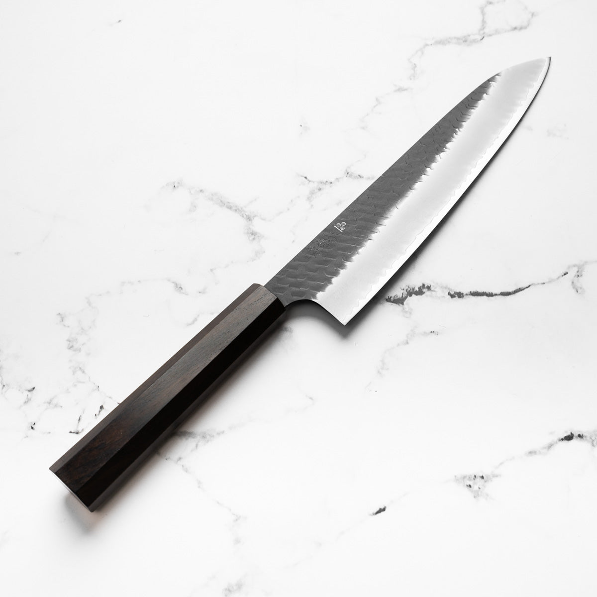 Nigara Hamono SG2 Kurouchi Tsuchime Gyuto 240mm - Ebony - angled view