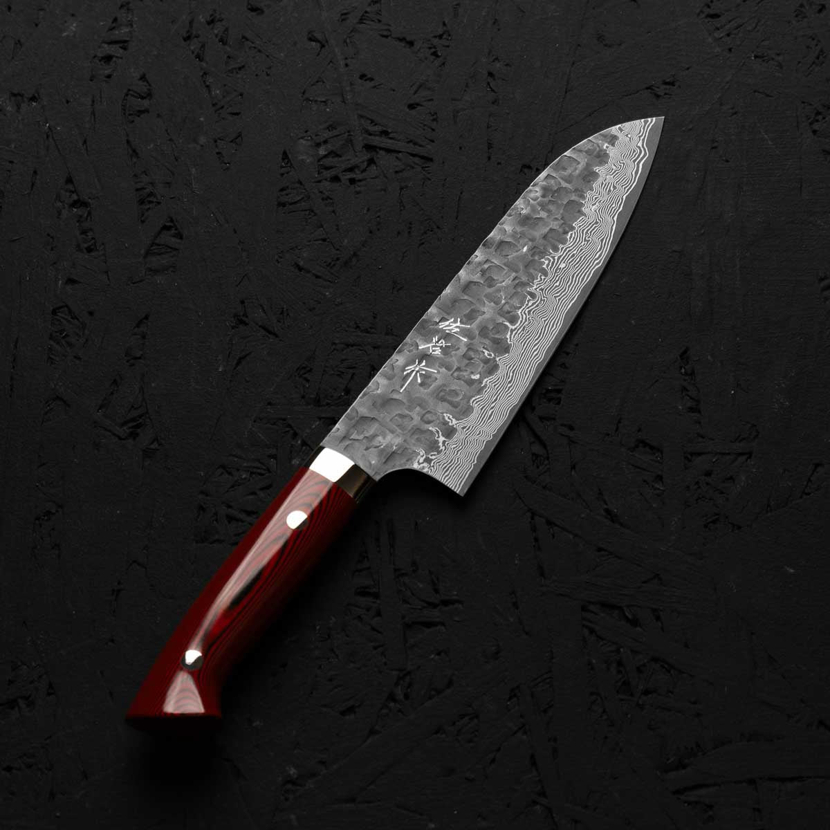 Takeshi Saji VG10 Forged Tsuchime Santoku - Red Weave - angled view